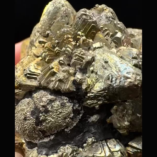 Bladed pyrite after marcasite rosette with rainbow tarnish from Pakistan — detail view