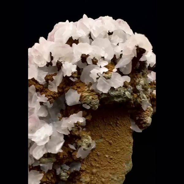 Upright cluster of pale pink rounded calcite with green-coated quartz from Inner Mongolia — detail view