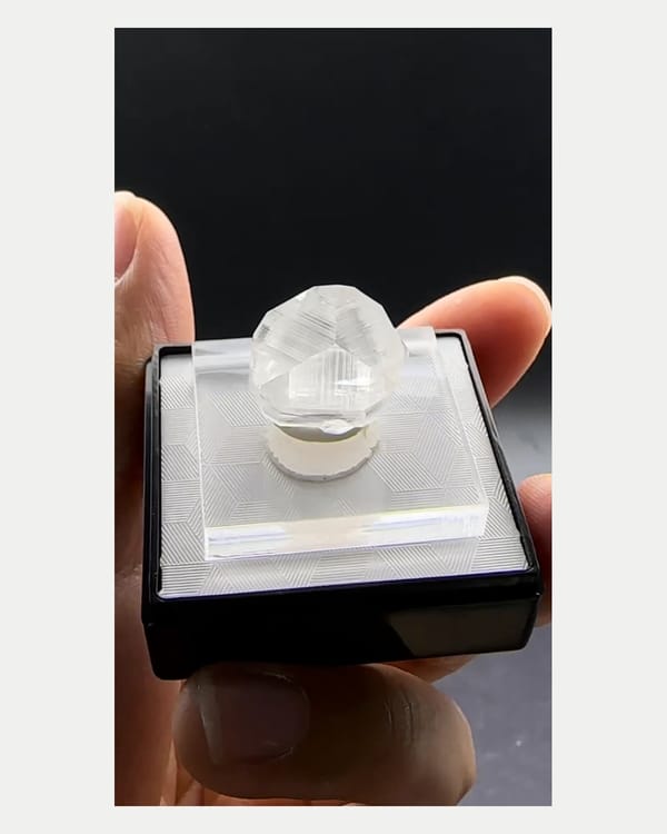 Complete right oblique view of clear calcite crystal