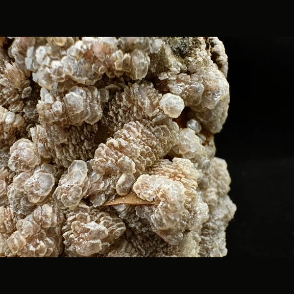 Quartz crusted with peach layered petal calcite and pyrite from Inner Mongolia — detail view