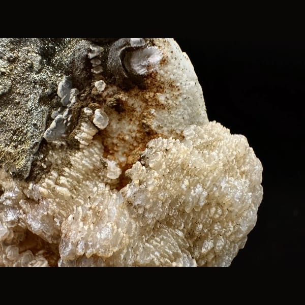 Quartz crusted with peach layered petal calcite and pyrite from Inner Mongolia — detail view