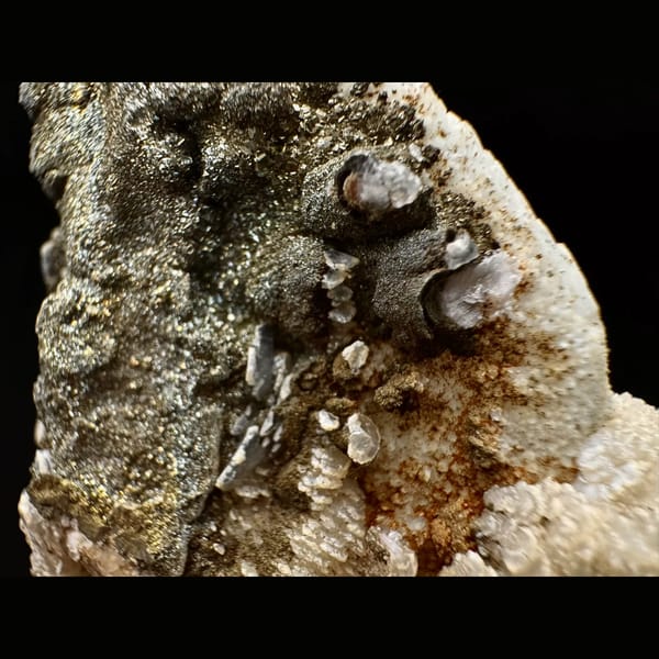Quartz crusted with peach layered petal calcite and pyrite from Inner Mongolia — detail view