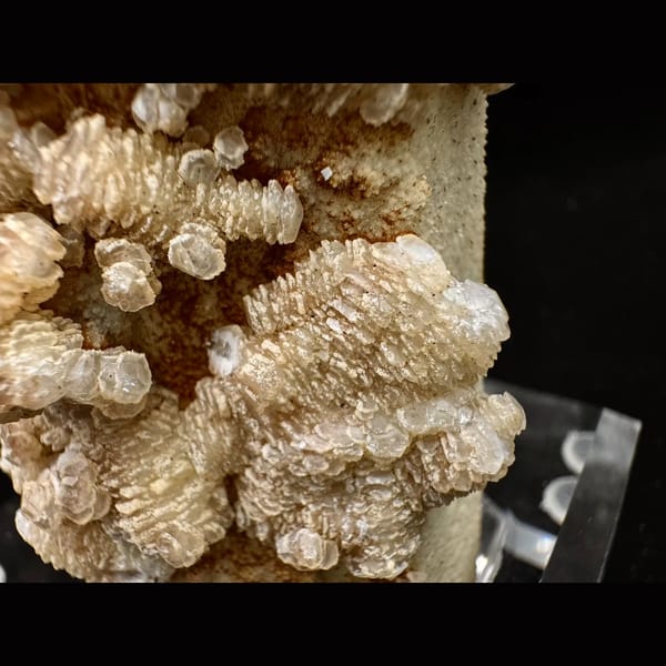 Quartz crusted with peach layered petal calcite and pyrite from Inner Mongolia — detail view