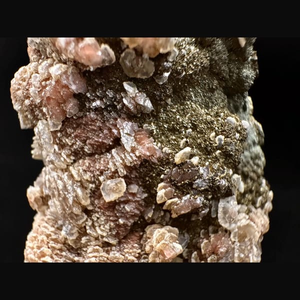 Quartz crusted with peach layered petal calcite and pyrite from Inner Mongolia — detail view
