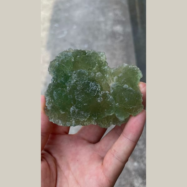 Large glassy apple-green stepped fluorite from Henan — alternate view