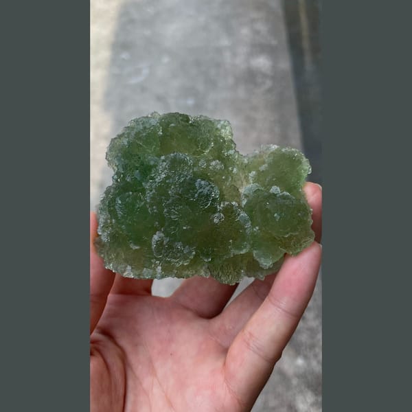 Large glassy apple-green stepped fluorite from Henan — alternate view
