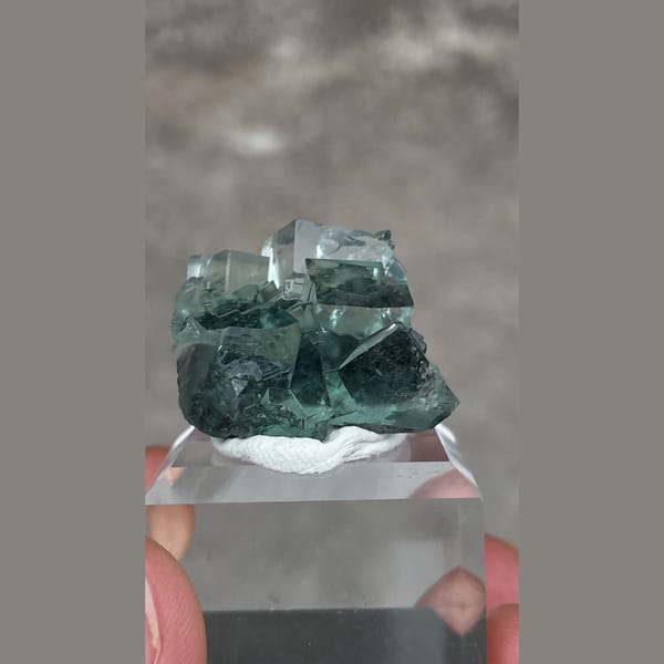 Transparent teal-green fluorite with wispy inclusions from Hunan — complete view