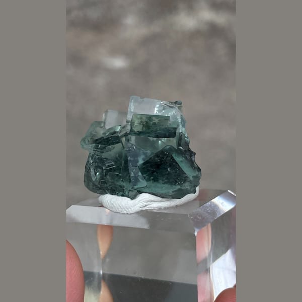 Transparent teal-green fluorite with wispy inclusions from Hunan — alternate view