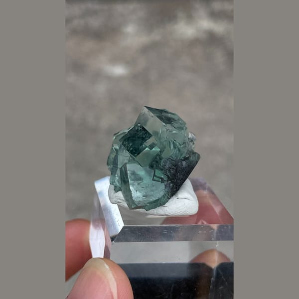 Transparent teal-green fluorite with wispy inclusions from Hunan — detail view