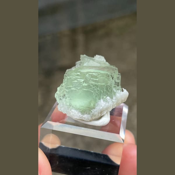 Pale mint-green stepped fluorite crystal from Fujian — complete view