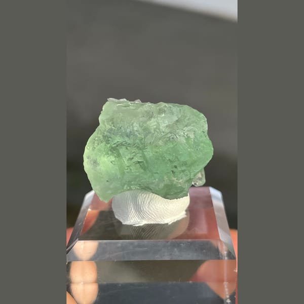 Naturally etched pale green fluorite with calcite from Fujian — complete view