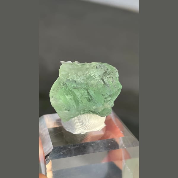 Naturally etched pale green fluorite with calcite from Fujian — alternate view