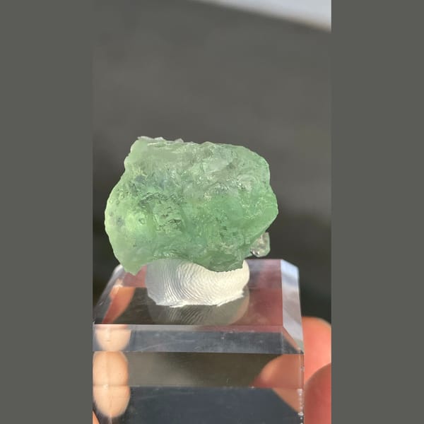 Naturally etched pale green fluorite with calcite from Fujian — alternate view
