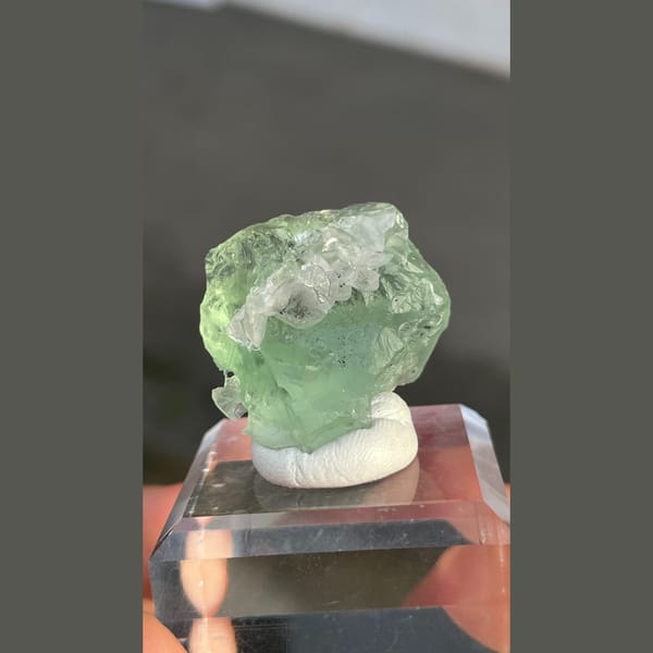 Naturally etched pale green fluorite with calcite from Fujian — detail view