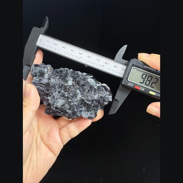 Plate of dark cubic fluorite with purple edges from Inner Mongolia — detail view