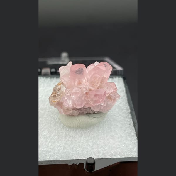 Small cluster of pink cobaltoan calcite crystals from Morocco — alternate view