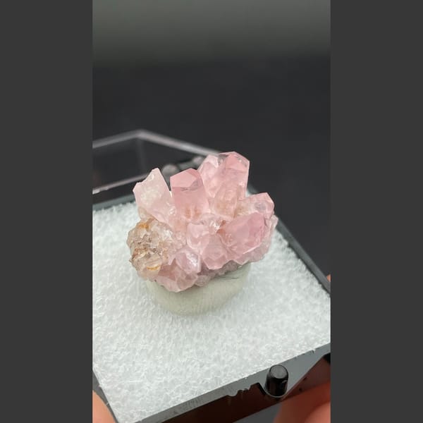 Small cluster of pink cobaltoan calcite crystals from Morocco — alternate view