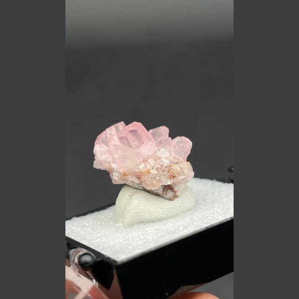 Small cluster of pink cobaltoan calcite crystals from Morocco — detail view