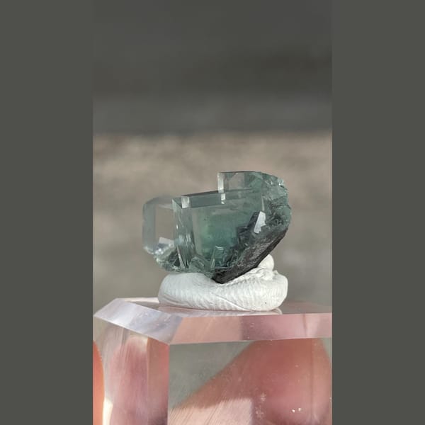 Transparent teal fluorite with wispy inclusions from Xianghualing, Hunan — alternate view