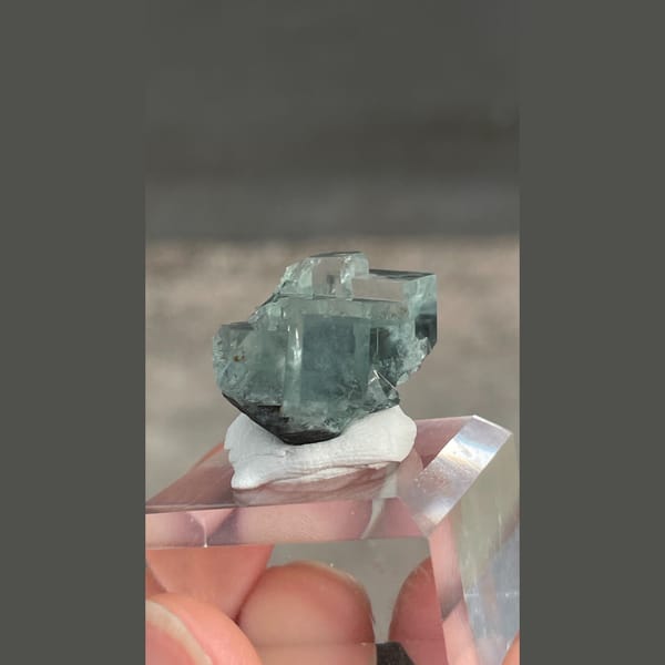 Transparent teal fluorite with wispy inclusions from Xianghualing, Hunan — alternate view