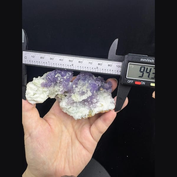 Purple creedite crystal clusters with white gypsum from Qinglong — detail view