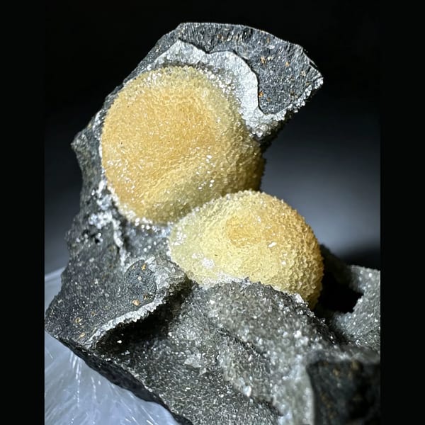 Yellow Calcite Spheres in Basalt Pocket Vietnam 7.0 cm — detail view