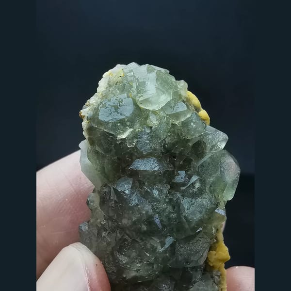 Pale green combined-form fluorite cluster — detail view