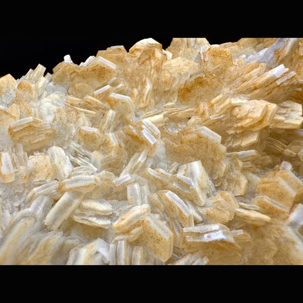 Pale yellow layered calcite blades on a plate from Fujian — alternate view