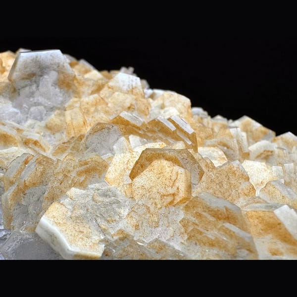 Pale yellow layered calcite blades on a plate from Fujian — detail view