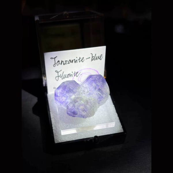 Three tanzanite-blue fluorite crystals — complete view