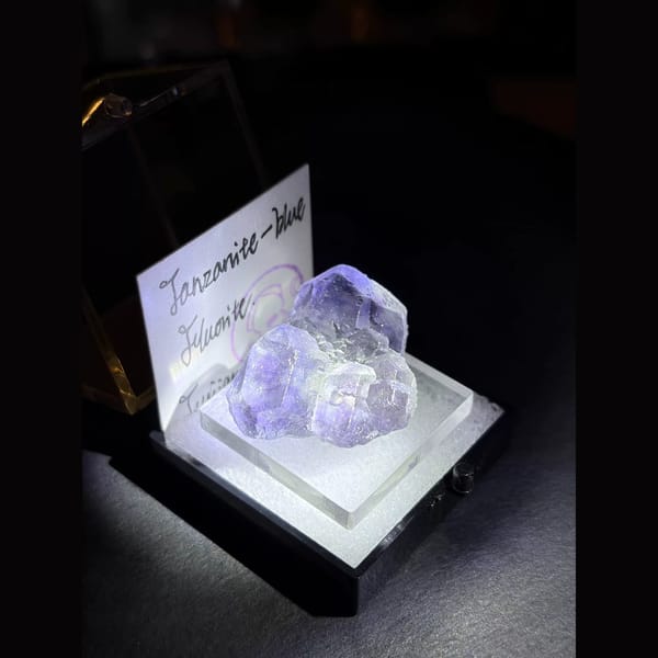 Three tanzanite-blue fluorite crystals — alternate view