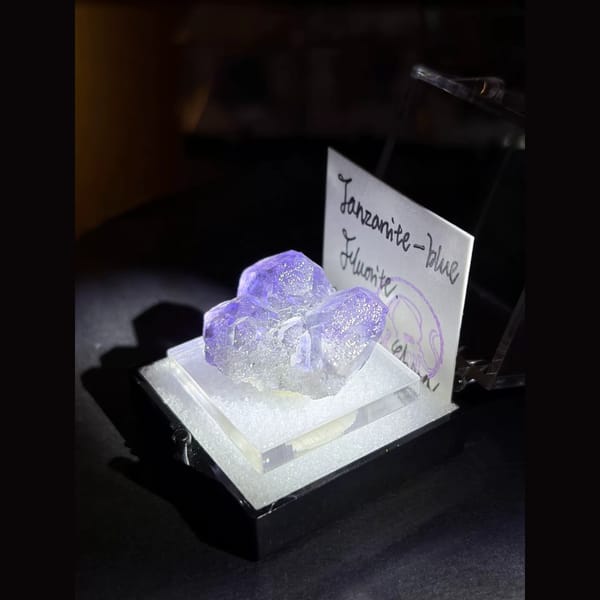 Three tanzanite-blue fluorite crystals — alternate view