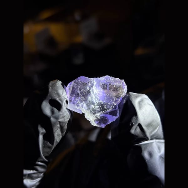Three tanzanite-blue fluorite crystals — detail view