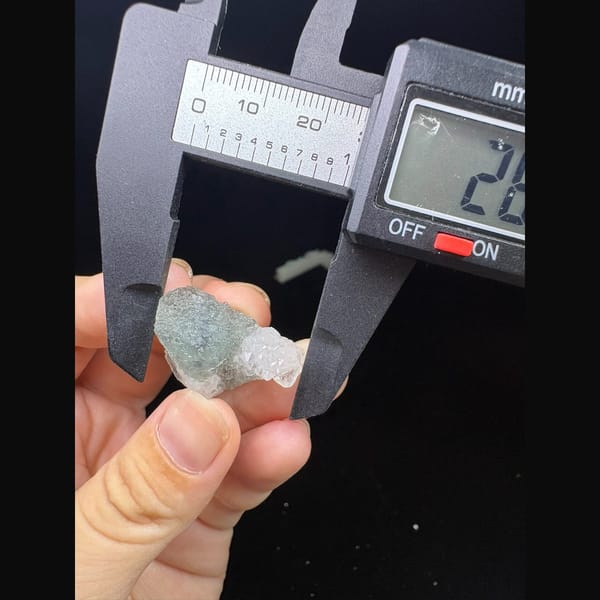 Small stepped octahedral fluorite with a blue core and quartz from Fujian — alternate view