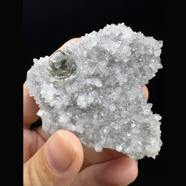 Pale green fluorite crystal in sparkling white quartz druse from Fujian — alternate view