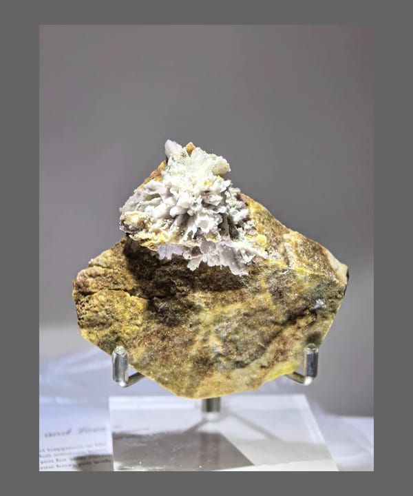 Complete front view of a purple creedite rosette on Yunnan matrix