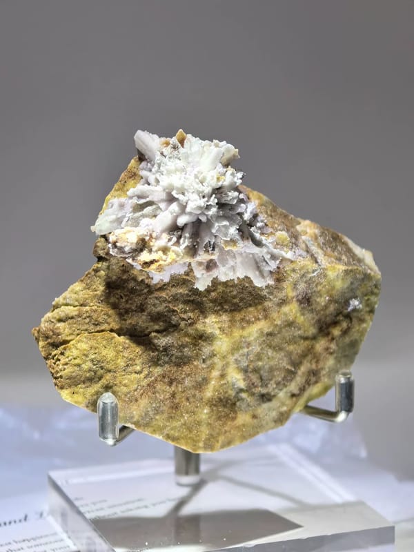 Complete front-right view of the same purple creedite specimen