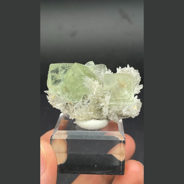 Icy pale green fluorite cubes with white quartz from Fujian — detail view