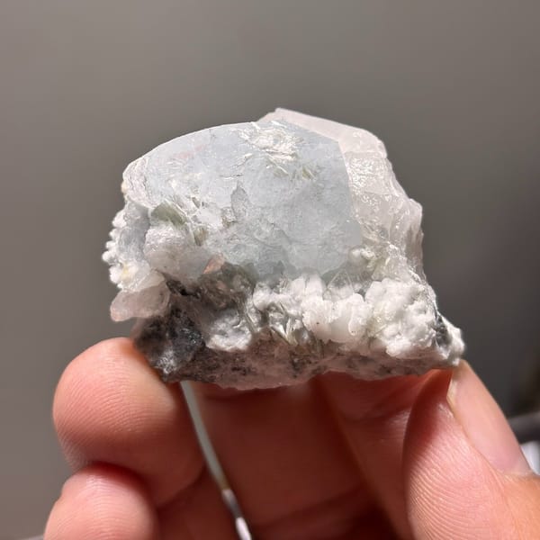 Xuebaoding aquamarine with feldspar B — alternate view
