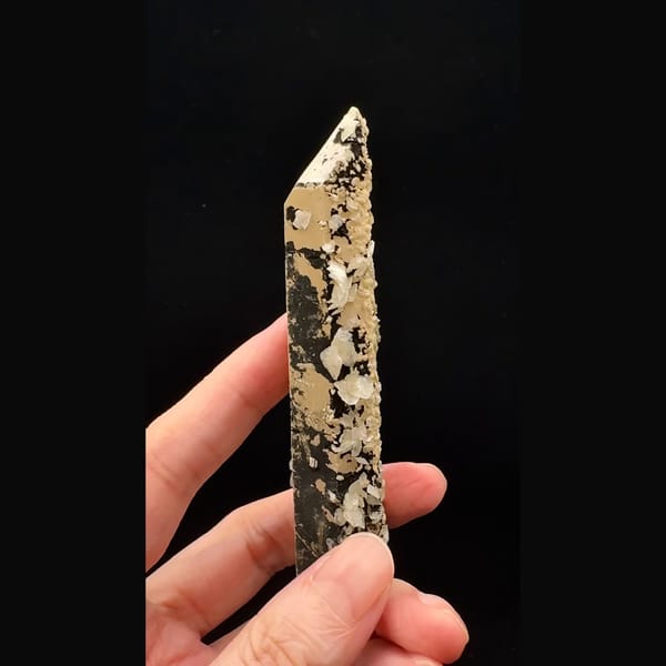 Tall quartz crystal crusted with bladed calcite and golden dolomite from Inner Mongolia — detail view