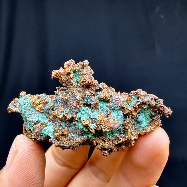 Bright green malachite crust on native copper — complete view