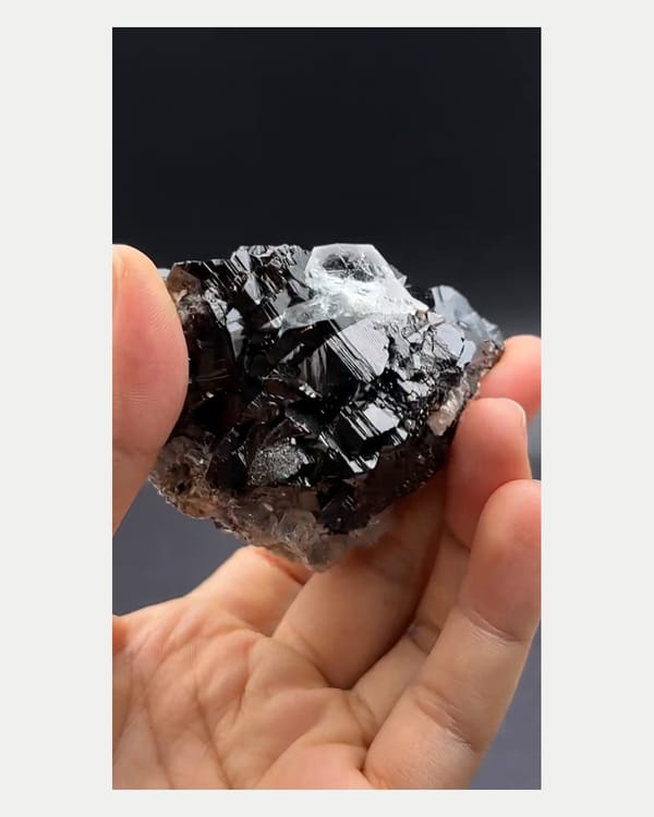 Complete reverse view of cassiterite with aquamarine crystals
