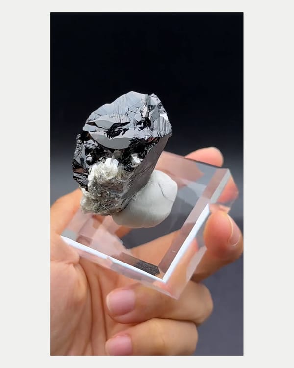 Complete left side view of lustrous cassiterite crystals