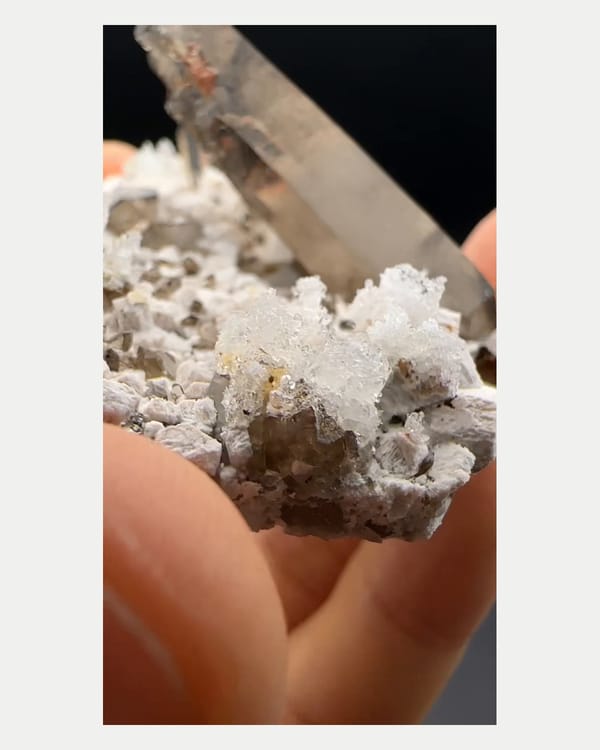 Complete reverse view of smoky quartz with hyalite and feldspar