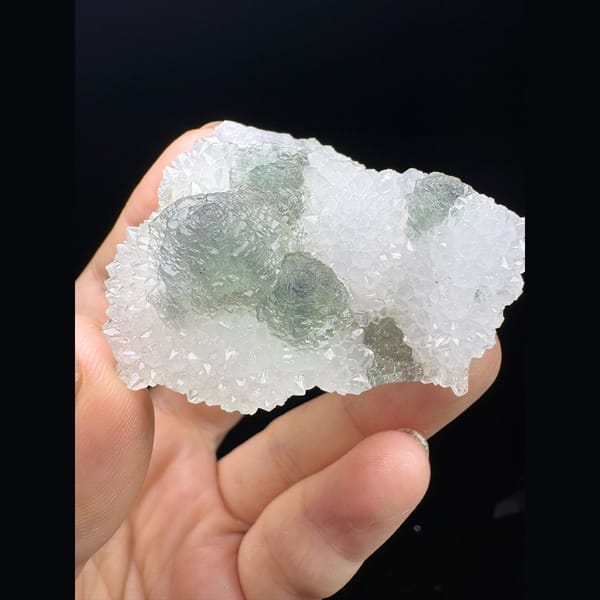 Stepped octahedral fluorite with blue cores in white quartz from Fujian — complete view
