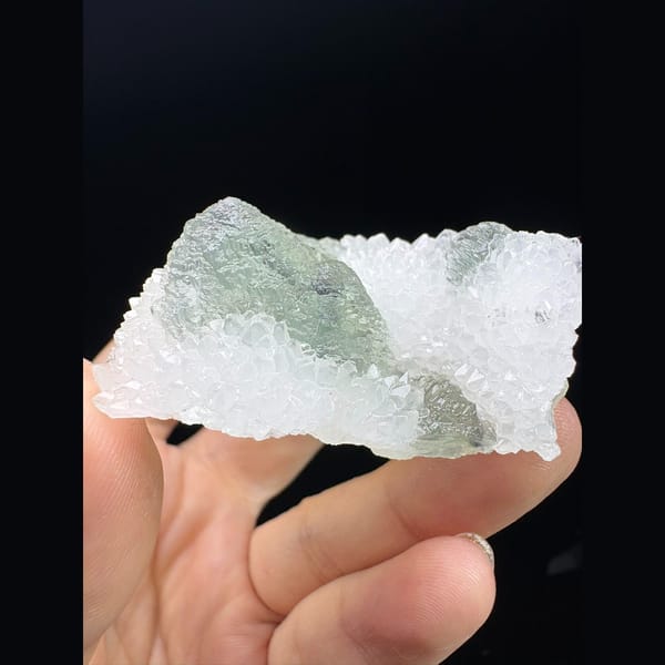 Stepped octahedral fluorite with blue cores in white quartz from Fujian — alternate view