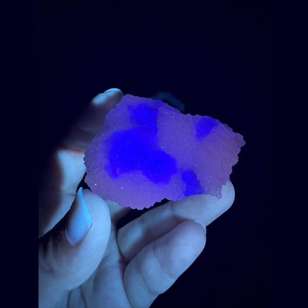 Stepped octahedral fluorite with blue cores in white quartz from Fujian — detail view