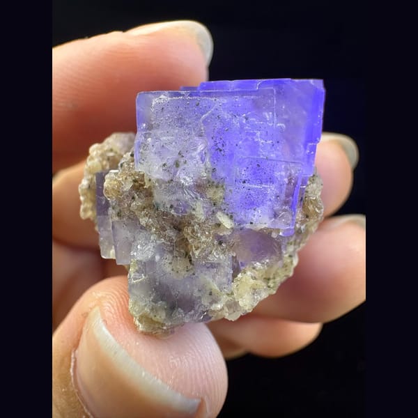 Small glassy purple fluorite with mica from Yaogangxian — complete view