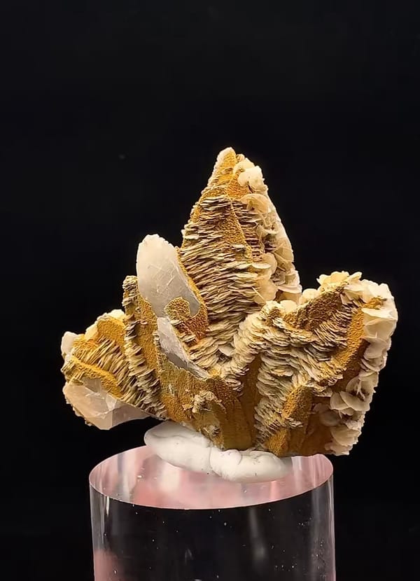 Complete reverse of the same calcite showing white crystal areas and ochre mineral-clay coating