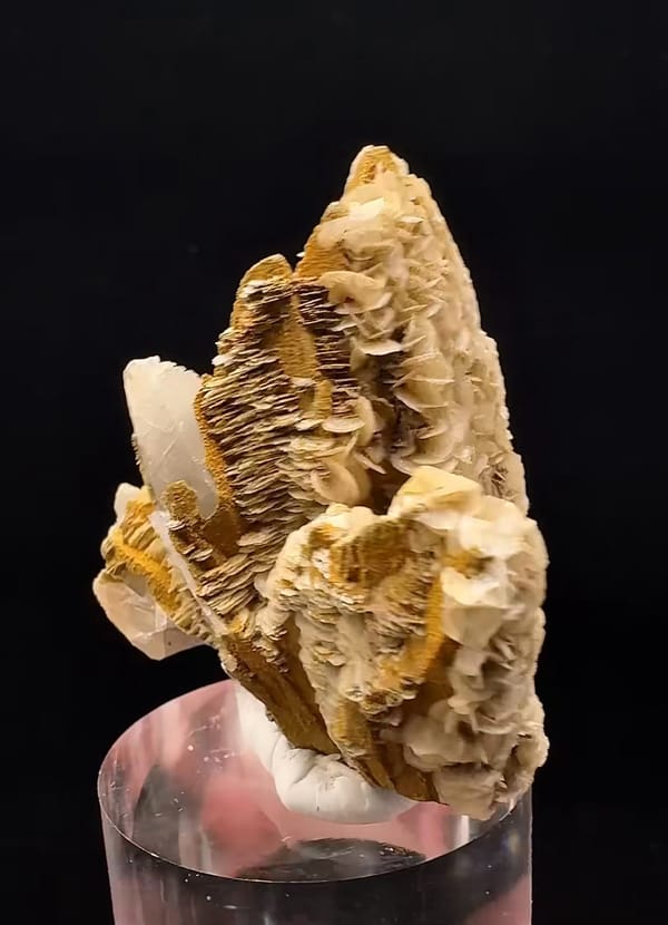 Complete opposite side of the calcite cluster showing stacked blades and the tapered centre